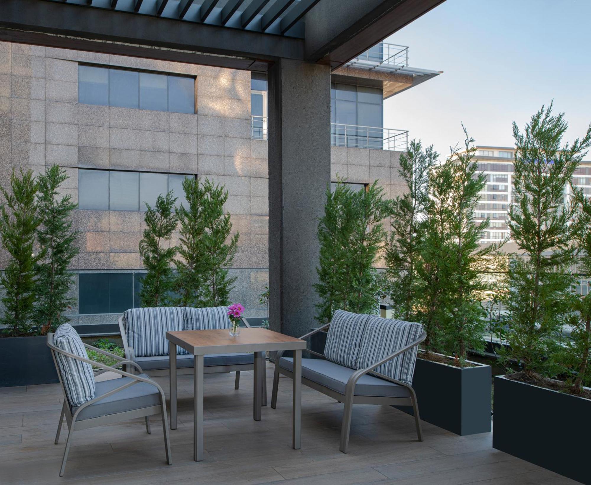 Movenpick Living Istanbul West Hotel Bagian luar foto A 3D rendering of a patio